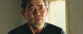 Movie still from “The Meg” (2018), directed by Jon Turteltaub – A person looking at the camera; Close Up shot, Over the shoulder angle