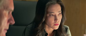 Movie still from “The Meg” (2018), directed by Jon Turteltaub – A person with long black hair; Close Up shot, Low angle