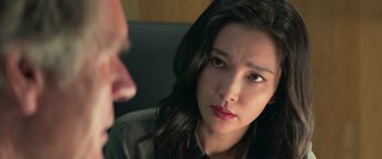 Movie still from “The Meg” (2018), directed by Jon Turteltaub – A person sitting in front of another person; Close Up shot, Over the shoulder angle