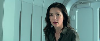 Movie still from “The Meg” (2018), directed by Jon Turteltaub – A person with long black hair; Close Up shot, Low angle