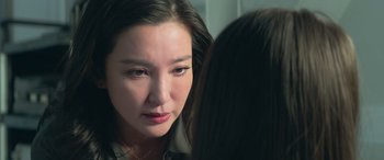 Movie still from “The Meg” (2018), directed by Jon Turteltaub – A person looking in a mirror; Close Up shot, Over the shoulder angle