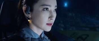 Movie still from “The Meg” (2018), directed by Jon Turteltaub – A person wearing a headset; Close Up shot, Over the shoulder angle