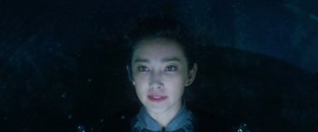 Movie still from “The Meg” (2018), directed by Jon Turteltaub – A young woman is looking into the camera; Close Up shot, Over the shoulder angle