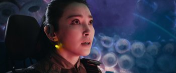 Movie still from “The Meg” (2018), directed by Jon Turteltaub – A person wearing a uniform; Close Up shot, Low angle