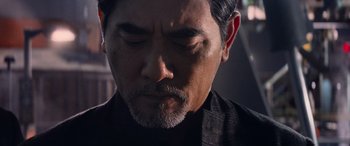 Movie still from “The Meg” (2018), directed by Jon Turteltaub – A person wearing a black shirt; Close Up shot, Over the shoulder angle