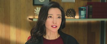 Movie still from “The Meg” (2018), directed by Jon Turteltaub – A person with long hair; Close Up shot, Over the shoulder angle