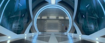 Movie still from “The Meg” (2018), directed by Jon Turteltaub – An empty room in a futuristic style with lights on; Wide shot, High angle