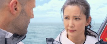 Movie still from “The Meg” (2018), directed by Jon Turteltaub – A person near a body of water; Close Up shot, Over the shoulder angle