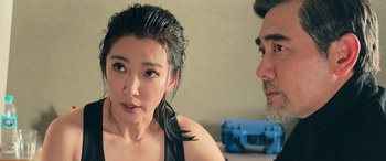 Movie still from “The Meg” (2018), directed by Jon Turteltaub – A man and a woman sitting next to each other; Close Up shot, Over the shoulder angle