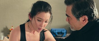 Movie still from “The Meg” (2018), directed by Jon Turteltaub – A man and a woman looking at one another; Close Up shot, Over the shoulder angle