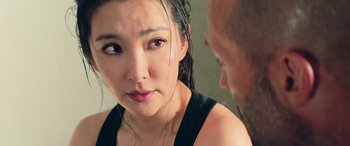 Movie still from “The Meg” (2018), directed by Jon Turteltaub – A woman looking at a man in the mirror; Close Up shot, Over the shoulder angle