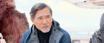 Movie still from “The Meg” (2018), directed by Jon Turteltaub – A person wearing a jacket; Close Up shot, Over the shoulder angle