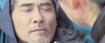 Movie still from “The Meg” (2018), directed by Jon Turteltaub – A person sleeping with his eyes closed; Extreme Close Up shot, Over the shoulder angle