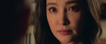 Movie still from “The Meg” (2018), directed by Jon Turteltaub – A woman's face with tears in her eyes; Close Up shot, Over the shoulder angle