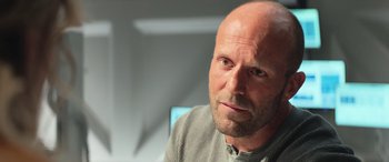 Movie still from “The Meg” (2018), directed by Jon Turteltaub – A man with a shaved head and a beard; Close Up shot, Low angle
