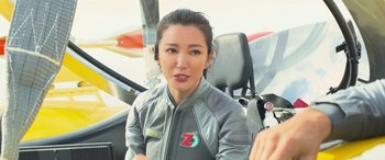 Movie still from “The Meg” (2018), directed by Jon Turteltaub – A woman sitting in the cockpit of an airplane; Close Up shot, Over the shoulder angle