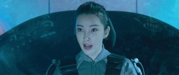 Movie still from “The Meg” (2018), directed by Jon Turteltaub – A young woman in a car seat looking into the camera; Close Up shot, Over the shoulder angle