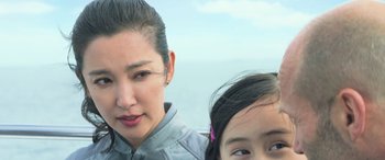 Movie still from “The Meg” (2018), directed by Jon Turteltaub – A person and a child; Close Up shot, Over the shoulder angle