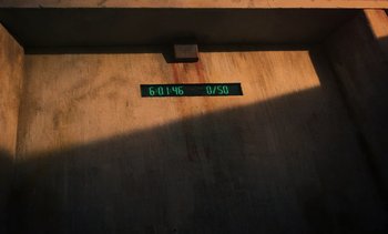 Movie still from “The Mill” (2023), directed by Sean King O'Grady – A clock on the side of a building; Extreme Close Up shot, High angle
