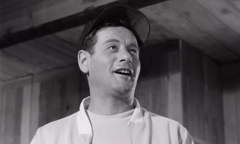 Movie still from “The Misfits” (1961), directed by John Huston – A black and white photo of a man wearing a hat; Close Up shot, Low angle