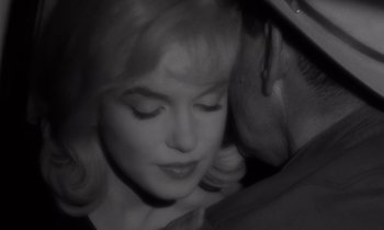 Movie still from “The Misfits” (1961), directed by John Huston – A black - and - white photo of a man and a woman; Close Up shot, High angle
