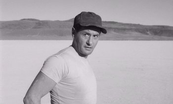 Movie still from “The Misfits” (1961), directed by John Huston – A black and white photo of a man wearing a hat; Close Up shot, Low angle