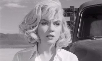 Movie still from “The Misfits” (1961), directed by John Huston – A black - and - white photo of a woman in a white shirt; Close Up shot, Low angle