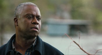 Movie still from “The Mist” (2007), directed by Frank Darabont – An older man is looking into the distance; Close Up shot, Over the shoulder angle