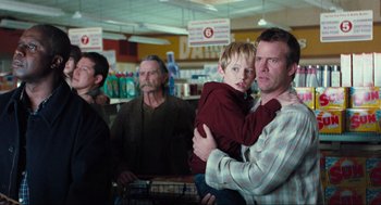 Movie still from “The Mist” (2007), directed by Frank Darabont – A group of people standing around a store; Medium shot, Over the shoulder angle