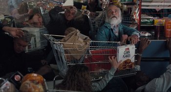 Movie still from “The Mist” (2007), directed by Frank Darabont – A group of people sitting around a grocery store; Medium shot, High angle