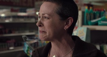 Movie still from “The Mist” (2007), directed by Frank Darabont – A person with short black hair; Close Up shot, Over the shoulder angle