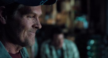 Movie still from “The Mist” (2007), directed by Frank Darabont – A person wearing a hat; Close Up shot, Over the shoulder angle