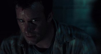 Movie still from “The Mist” (2007), directed by Frank Darabont – A person looking at the camera; Close Up shot, Low angle