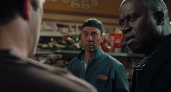 Movie still from “The Mist” (2007), directed by Frank Darabont – A group of men standing next to each other in a store; Close Up shot, Over the shoulder angle