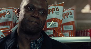 Movie still from “The Mist” (2007), directed by Frank Darabont – A person in front of a row of potato chips; Close Up shot, Over the shoulder angle