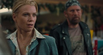 Movie still from “The Mist” (2007), directed by Frank Darabont – A woman standing next to a man in a green jacket; Close Up shot, Over the shoulder angle