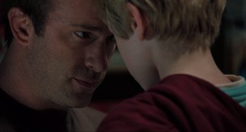 Movie still from “The Mist” (2007), directed by Frank Darabont – A man and a boy looking at each other; Close Up shot, Over the shoulder angle