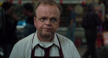 Movie still from “The Mist” (2007), directed by Frank Darabont – A man in a white shirt and a red tie; Close Up shot, Over the shoulder angle