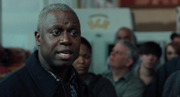 Movie still from “The Mist” (2007), directed by Frank Darabont – A man with a beard is looking into the distance; Close Up shot, Over the shoulder angle