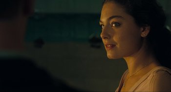 Movie still from “The Mist” (2007), directed by Frank Darabont – A beautiful young lady looking to her left; Close Up shot, Over the shoulder angle