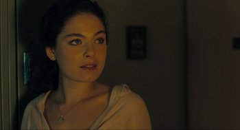 Movie still from “The Mist” (2007), directed by Frank Darabont – A beautiful young lady looking at the camera; Close Up shot, Over the shoulder angle