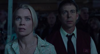 Movie still from “The Mist” (2007), directed by Frank Darabont – A man and a woman standing next to each other in a room; Close Up shot, Low angle