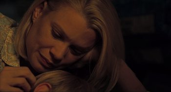 Movie still from “The Mist” (2007), directed by Frank Darabont – A person with a child; Close Up shot, High angle