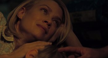 Movie still from “The Mist” (2007), directed by Frank Darabont – A person laying on a bed; Close Up shot, High angle