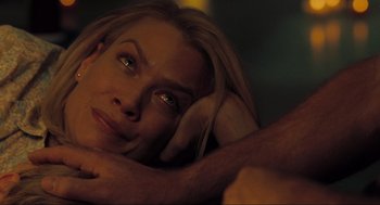 Movie still from “The Mist” (2007), directed by Frank Darabont – A woman's face with her hand on her head; Close Up shot, Over the shoulder angle