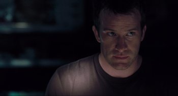 Movie still from “The Mist” (2007), directed by Frank Darabont – A person looking at the camera; Close Up shot, Low angle
