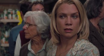 Movie still from “The Mist” (2007), directed by Frank Darabont – A woman and an older woman are looking at the camera; Close Up shot, Over the shoulder angle