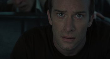 Movie still from “The Mist” (2007), directed by Frank Darabont – A person looking at the camera; Close Up shot, Over the shoulder angle