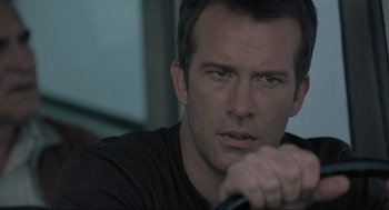 Movie still from “The Mist” (2007), directed by Frank Darabont – A person holding a stick; Close Up shot, Over the shoulder angle