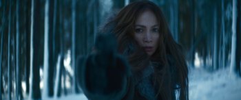 Movie still from “The Mother” (2023), directed by Niki Caro – A person wearing a fur coat; Close Up shot, Over the shoulder angle